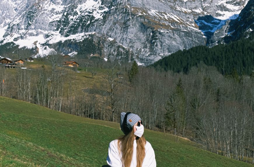 Woman wearing face mask on mountain