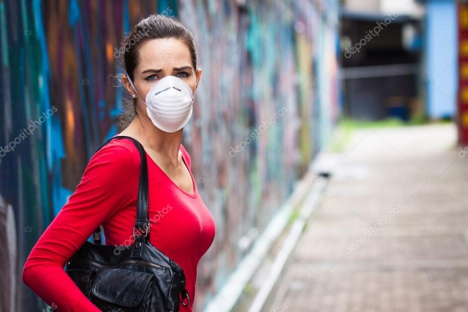 Unhappy woman wearing face mask
