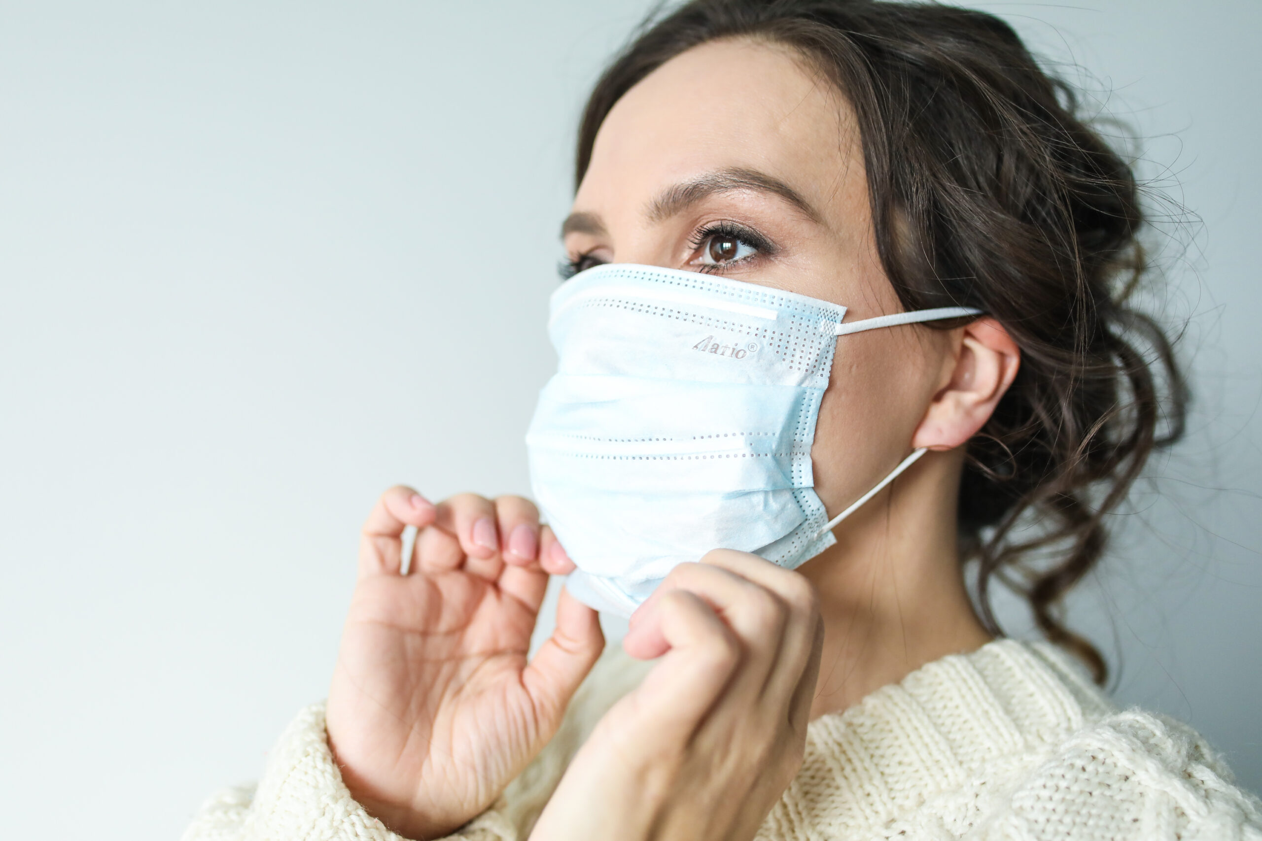 Woman in white face mask