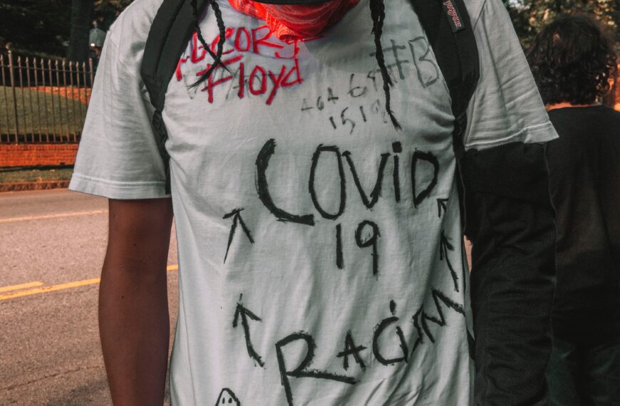 a protestor's shirt with handwritten messages